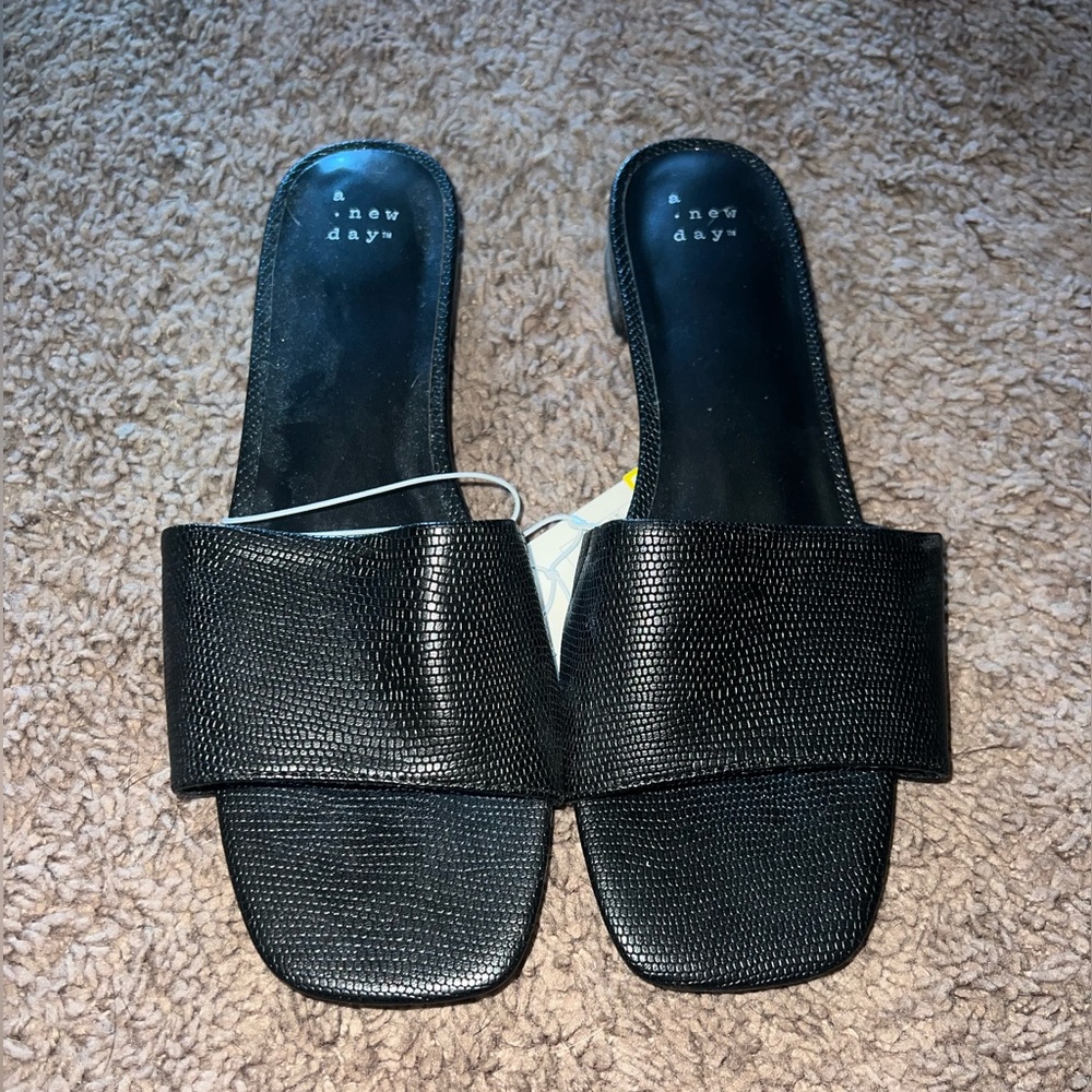 Black sandals with an inch heel. Never worn. Bought from target. Size 9.